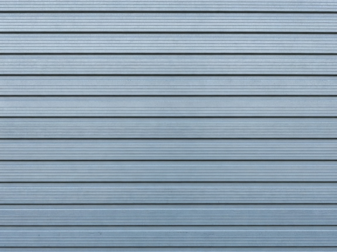Ribbed steel garage door with micro-groove horizontal pattern
